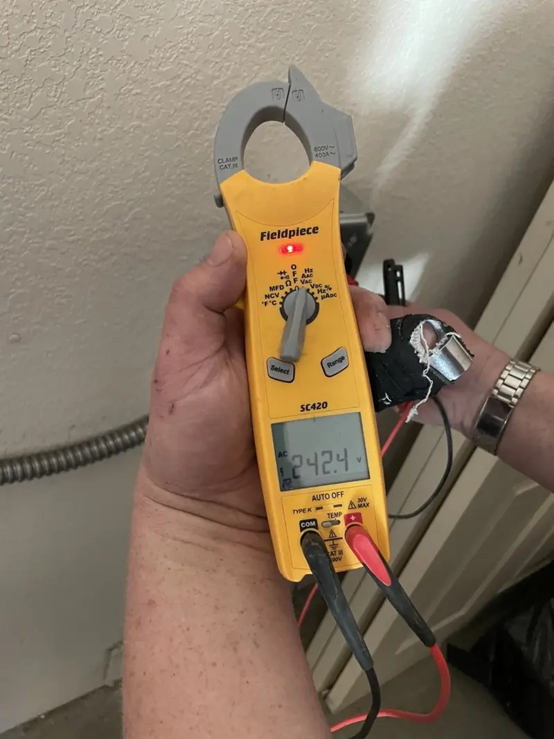 Voltage testing with clamp meter during Recessed Lighting Installation in Chesterfield
